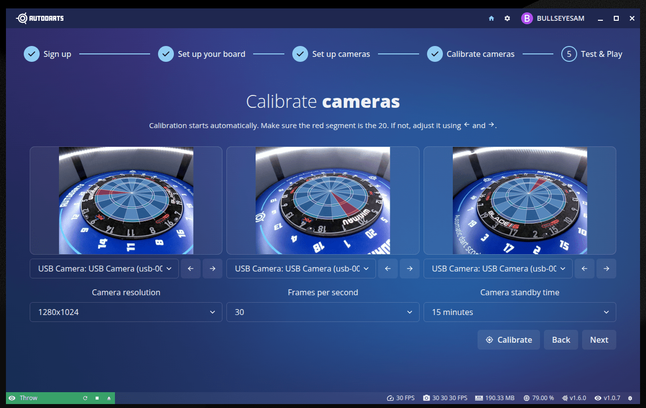 Calibrate cameras step showing the three camera feeds with a highlighted segment overlay that should be rotated onto 20, plus left/right rotation buttons and a Calibrate button