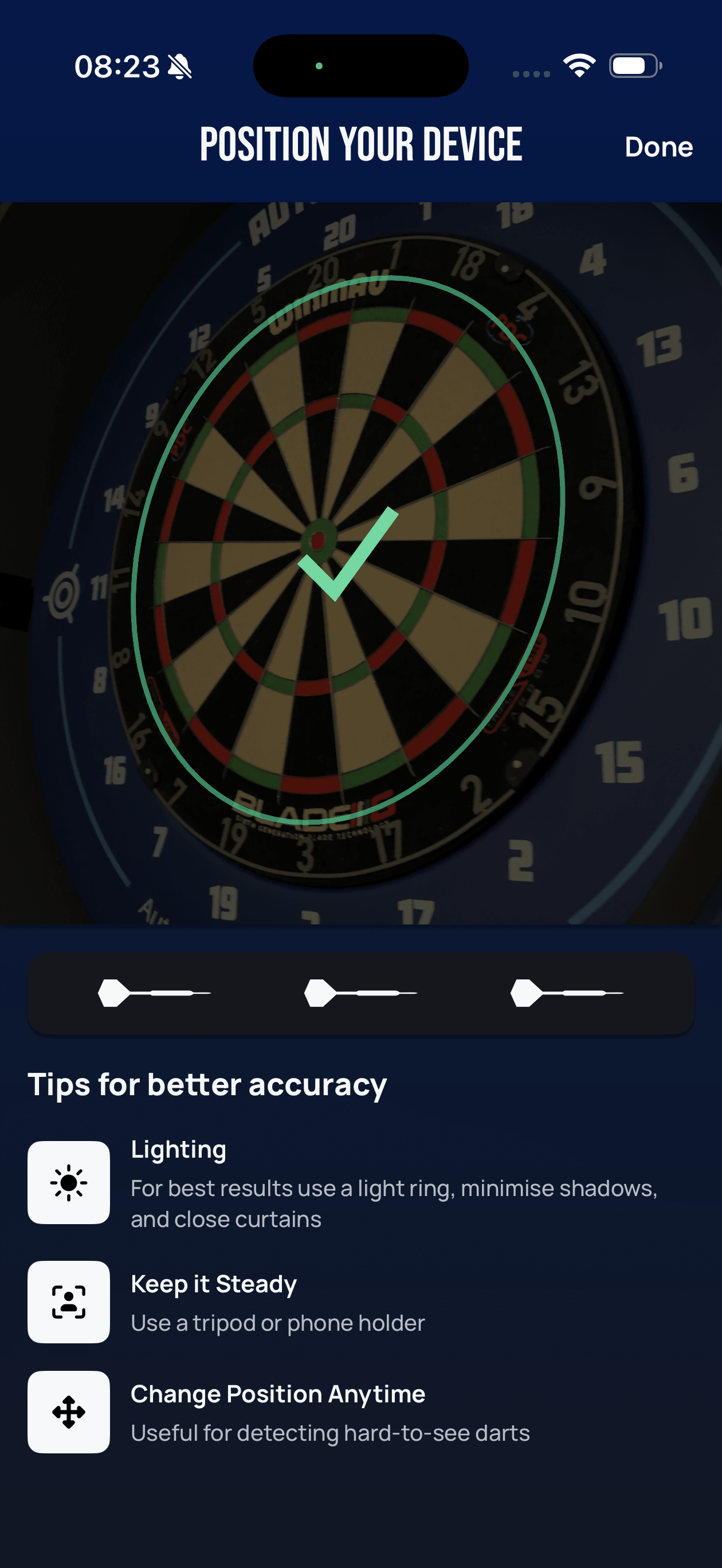Lens Position your device screen showing a green outline traced around the dartboard with a large green checkmark confirming the position